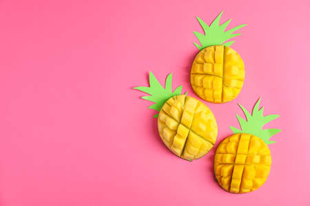 Flat lay composition with ripe mangoes and space for text on color backgroundの写真素材