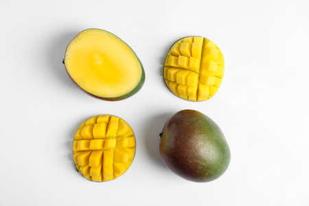 Flat lay composition with ripe mangoes on white backgroundの写真素材