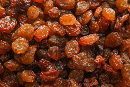 Delicious dried grape raisins as background, closeupの写真素材