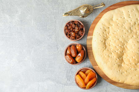 Ramadan Kareem food and Aladdin Lamp on grey table, top viewの写真素材