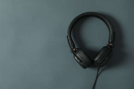 Headphones on dark background, space for textの写真素材