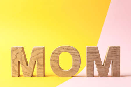 Inscription mom on two tone background, space for textの写真素材