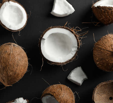 Flat lay composition with coconuts on black backgroundの写真素材