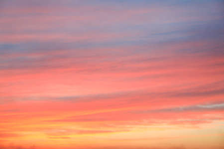 Dramatic sunset sky background with fiery clouds, yellow, orange and pink colour, nature background....