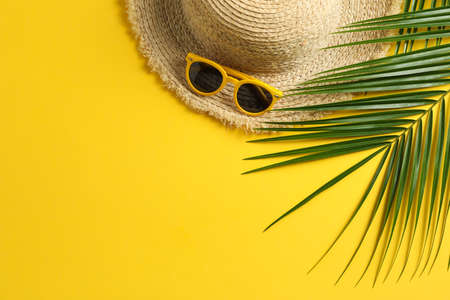 Summer vacation composition on yellow background. Space for text, top viewの写真素材