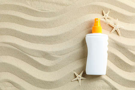Clear sea sand with sunscreen and starfishes, space for text. Summer vacation backgroundの写真素材