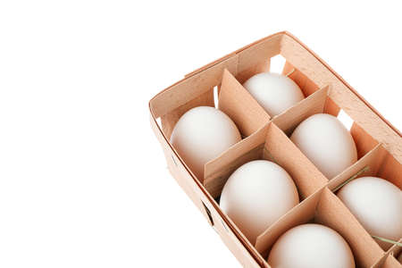 White chicken eggs in carton box isolated on white backgroundの写真素材