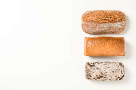 Flat lay composition with bakery products on white background, space for textの写真素材