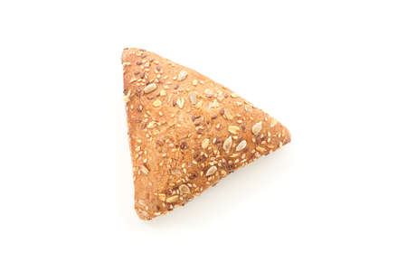 Triangular bun isolated on white background, top view. Bakery products