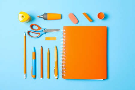 Flat lay composition with school supplies on color background, space for textの写真素材