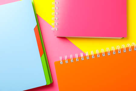 Composition with copybooks on two tone background, space for textの写真素材