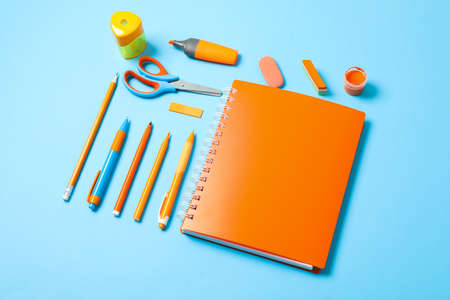 Flat lay composition with school supplies on color background, space for textの写真素材