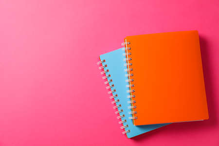 School copybooks on color background, space for textの写真素材