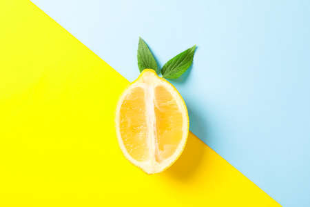 Fresh lemon on two tone background, space for textの写真素材