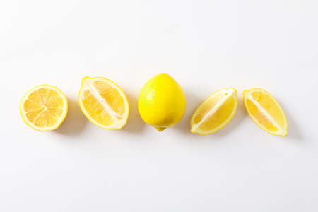 Flat lay composition with lemons on white background, space for textの写真素材