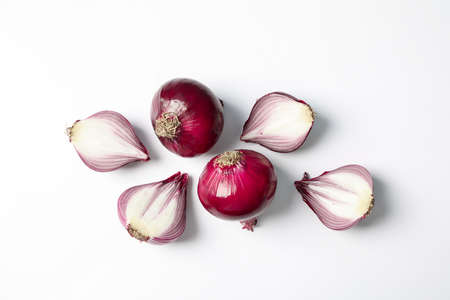 Flat lay composition with red onion and spices on white backgroundの写真素材