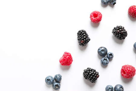 Flat lay composition with berries on white background, space for textの写真素材
