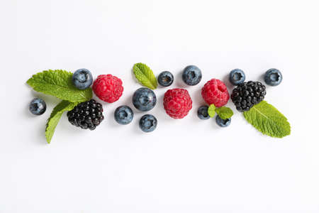 Flat lay composition with berries on white background, space for textの写真素材
