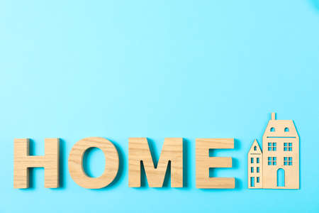 Word House lined with wooden letters on color background, top viewの写真素材