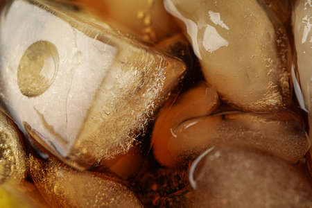 Side view of cola and ice, close upの写真素材