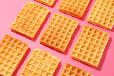 Flat lay composition with belgian waffles on color backgroundの写真素材