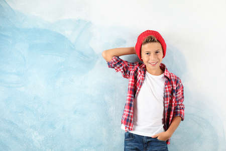 Fashion boy on color background, space for text