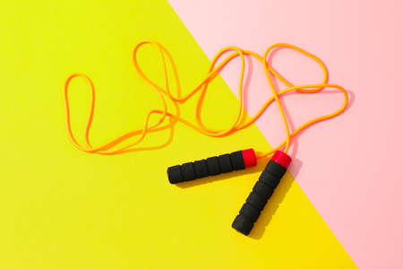 Jump rope on two tone background, space for textの写真素材