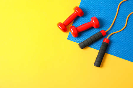 Flat lay composition with healthy lifestyle accessories on color backgroundの写真素材