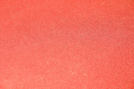 Red rubber running track background, top viewの写真素材