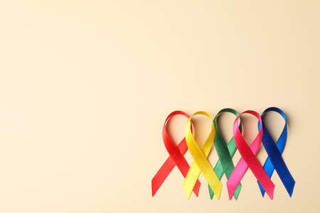 Flat lay composition with awareness ribbons on color background, space for text.の写真素材