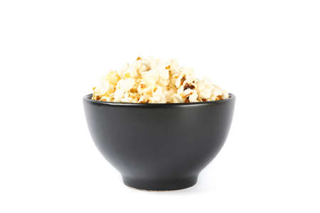 Black bowl with popcorn isolated on white backgroundの写真素材