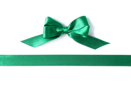 Green ribbon and bow isolated on white background. Gift conceptの写真素材
