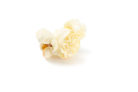 Piece of popcorn isolated on white background, close upの写真素材