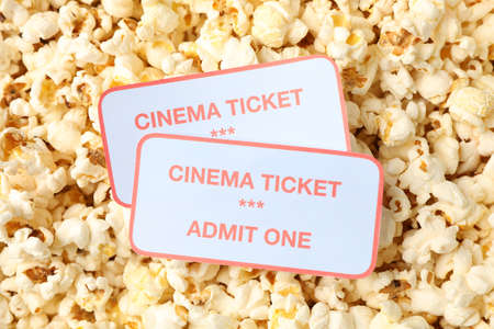Cinema tickets on popcorn background, close upの写真素材