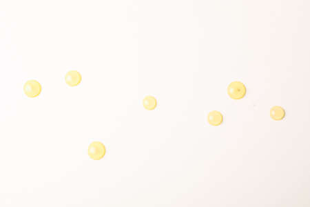Honey drops on white background, space for textの写真素材