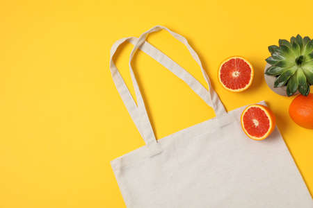 Eco bag, succulent plant and orange on color background, copy spaceの写真素材
