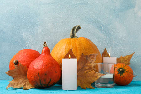 Composition with pumpkins and candles on wooden background, space for textの写真素材