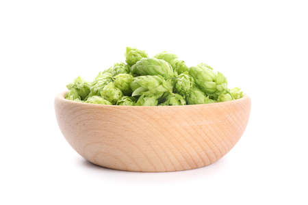 Wooden bowl with hop cones isolated on white background