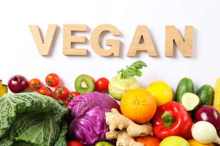 Word Vegan, different vegetables and fruits isolated on white backgroundの写真素材