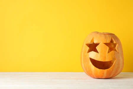 Halloween decorative pumpkin on wooden background, copy spaceの写真素材