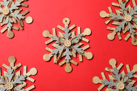 Decorative snowflakes on red background, space for text