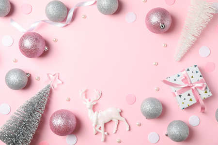 Christmas balls and presents on pink background, space for textの写真素材