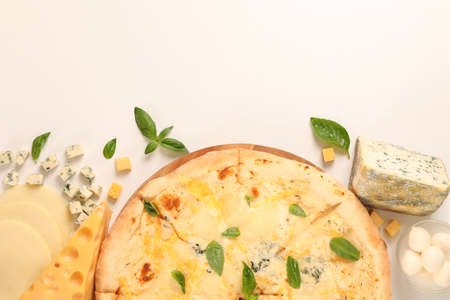 Flat lay. Cheese pizza and ingredients on white background, copy space