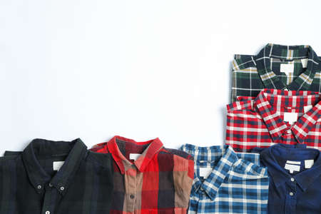 Flat lay with different shirts on white background, copy spaceの写真素材