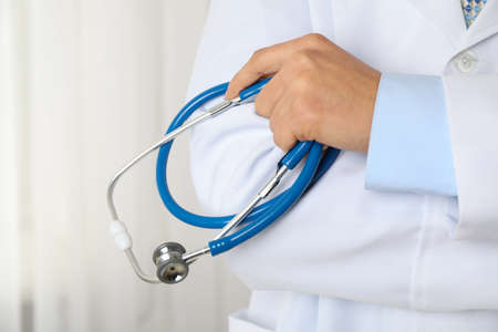 Doctor holds a stethoscope, close up and space for textの写真素材