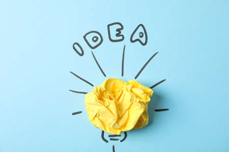 Drawn light bulb and paper ball on blue background. Good idea conceptの写真素材