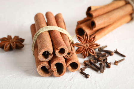 Cinnamon sticks and anise on white background, space for textの写真素材