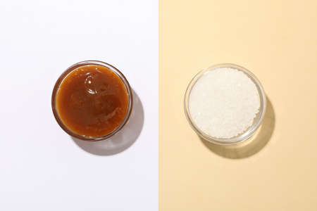 Glass jar with salted caramel on two tone background, copy spaceの写真素材