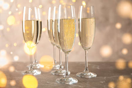 Champagne glasses against blurred lights background. Bokeh effectの写真素材