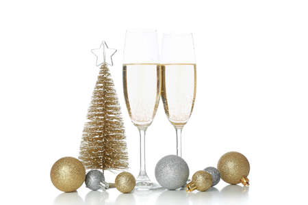 Champagne glasses and baubles isolated on white backgroundの写真素材